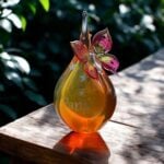 GU2007 | Urn and butterfly of pink and yellow transparent glass personalized