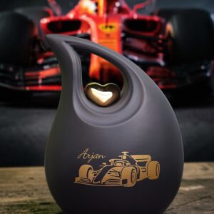 Black ceramic urn with race car design for teardrop ash cremation ashes with space for name.